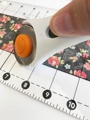 Placing your rotary cutter onto the ruler